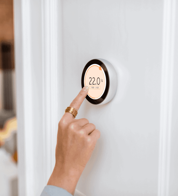 Person sets smart thermostat to 22°C for comfortable home temperature with JP Heating & Cooling in Buffalo, NY.
