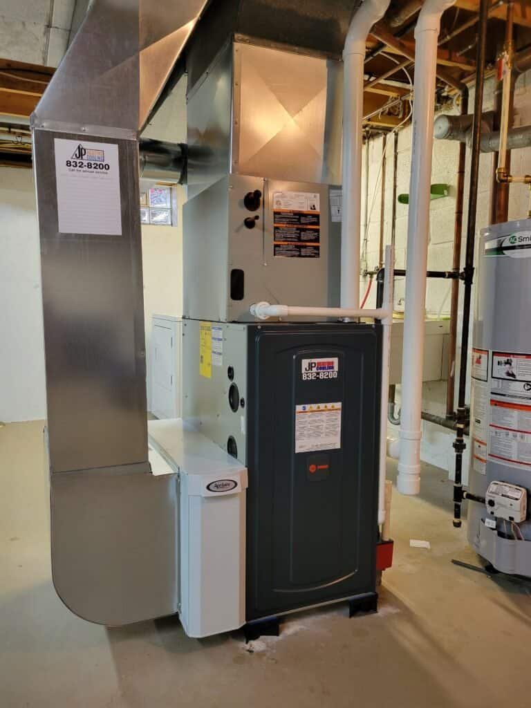 JP Heating & Cooling HVAC and furnace set up in a basement, ready to heat or cool homes in Amherst, NY.
