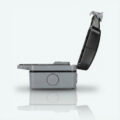 Weatherproof outdoor extension cord enclosure shown from the side with its hinged lid open