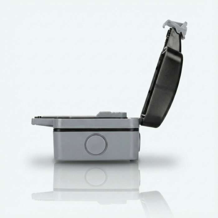 Weatherproof outdoor extension cord enclosure shown from the side with its hinged lid open