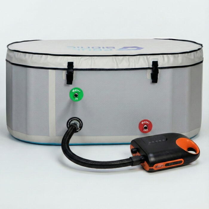 Electric air pump connected by hose to the inflation valve of the Vitalis 3 inflatable tub
