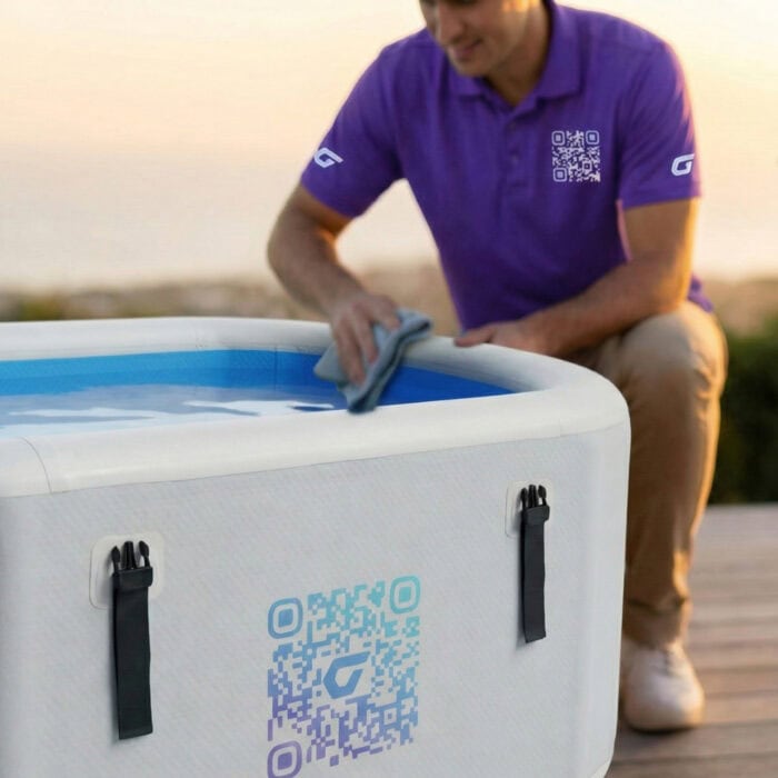 Technician wiping the rim of a Vitalis 3 inflatable ice bath tub with a cloth, Member Care+ maintenance service