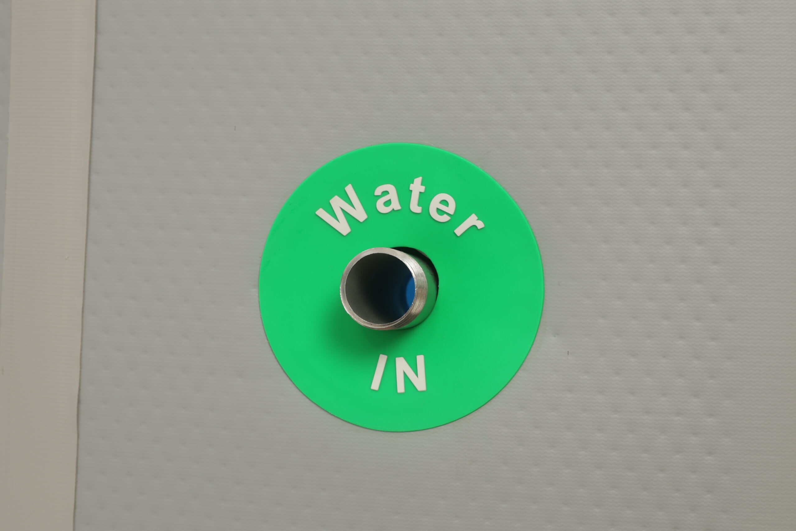 Close-up of the Performance Immersion Tub dual water ports