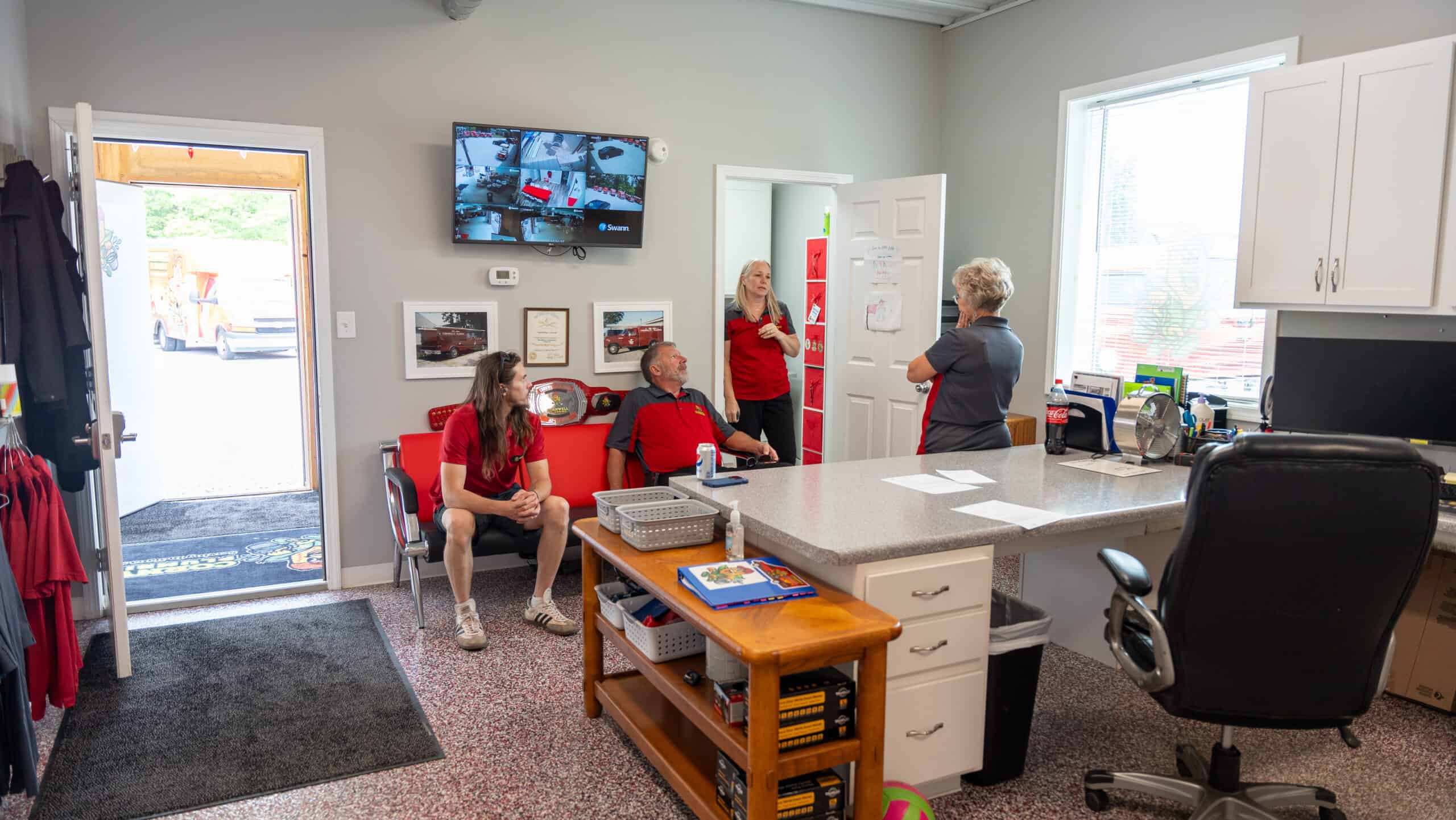 Reliable commercial plumbing services team meeting in a busy office environment, emphasizing professional plumbing solutions and customer service.