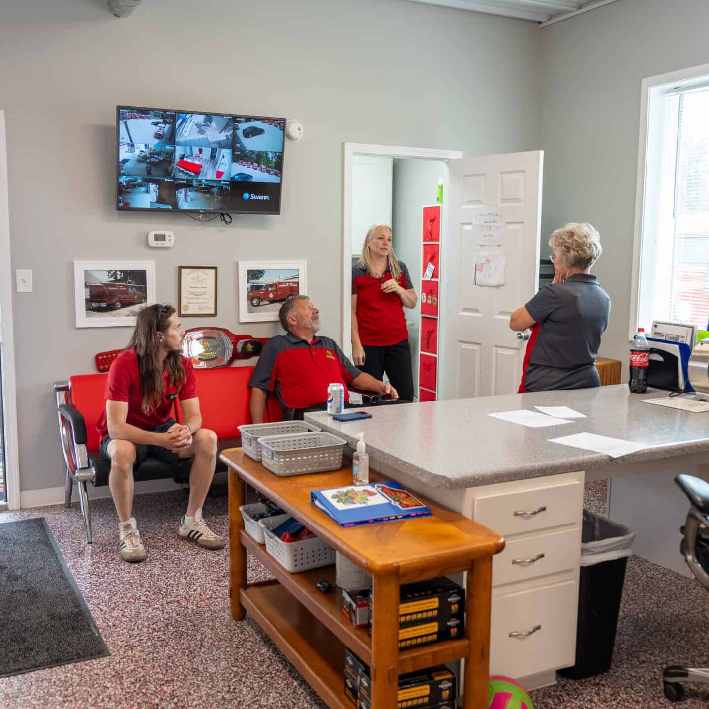 Reliable commercial plumbing services team meeting in a busy office environment, emphasizing professional plumbing solutions and customer service.