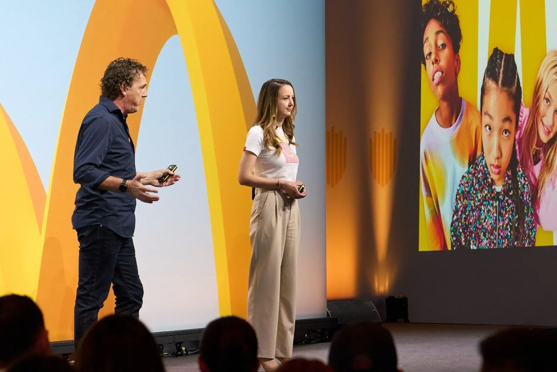 Jo Lepore presenting alongside a colleague at a McDonald's event