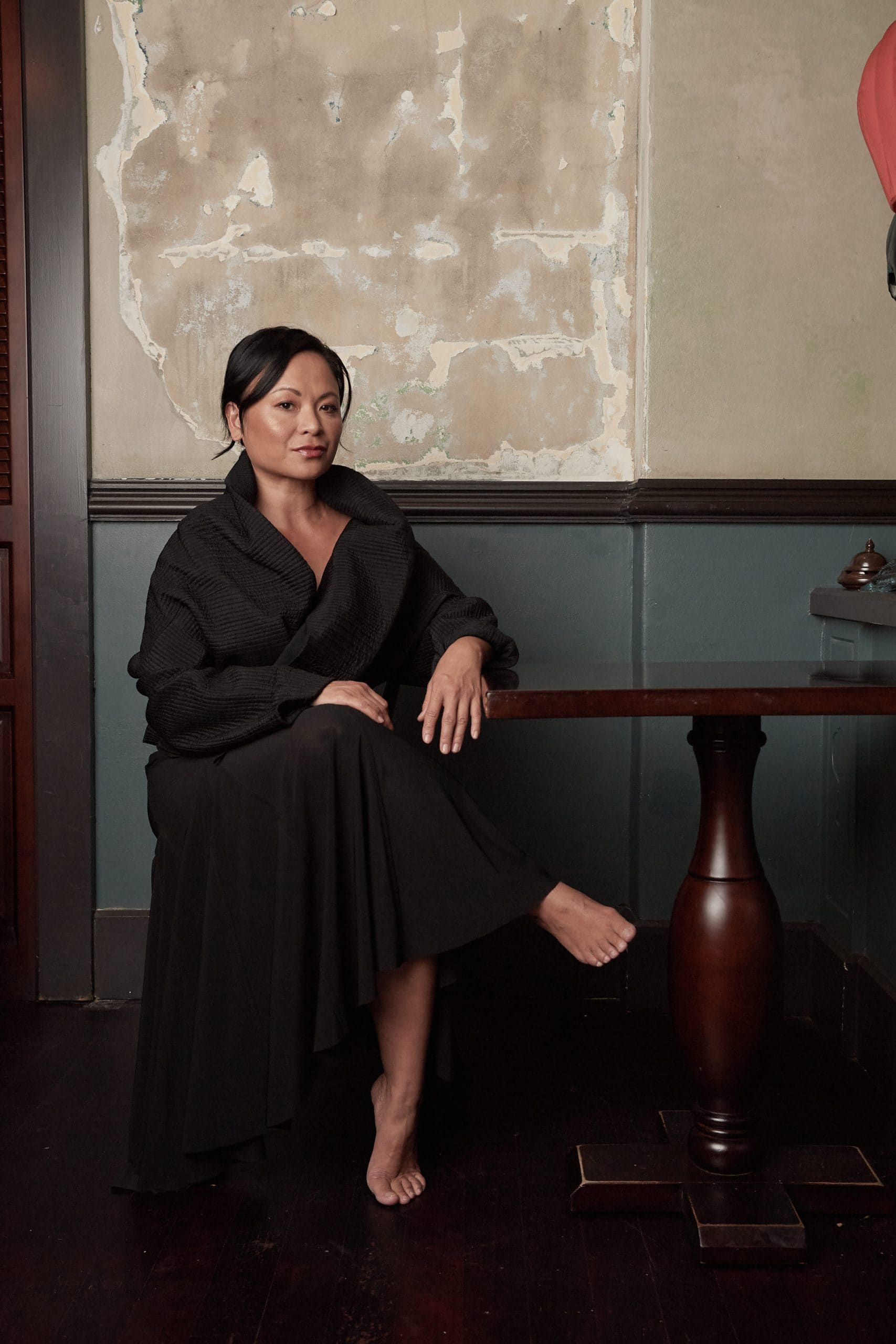 Pauline Nguyen seated portrait in black