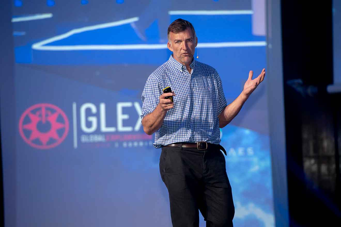 Tim Jarvis speaking on stage at the GLEX Summit