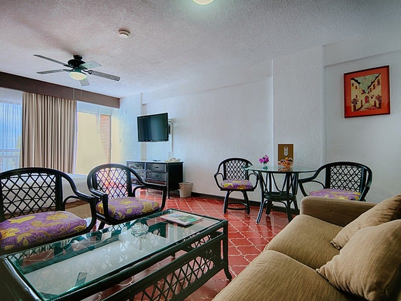 A cozy living room featuring a couch and a television, creating a comfortable space for relaxation and entertainment.
