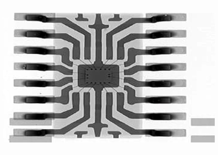 X-ray radiograph of a packaged wire-bonded electronic component highlighting lead frame, die, and bond wire structure