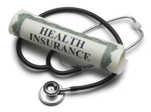 Health insurance document with stethoscope and stethoscope.