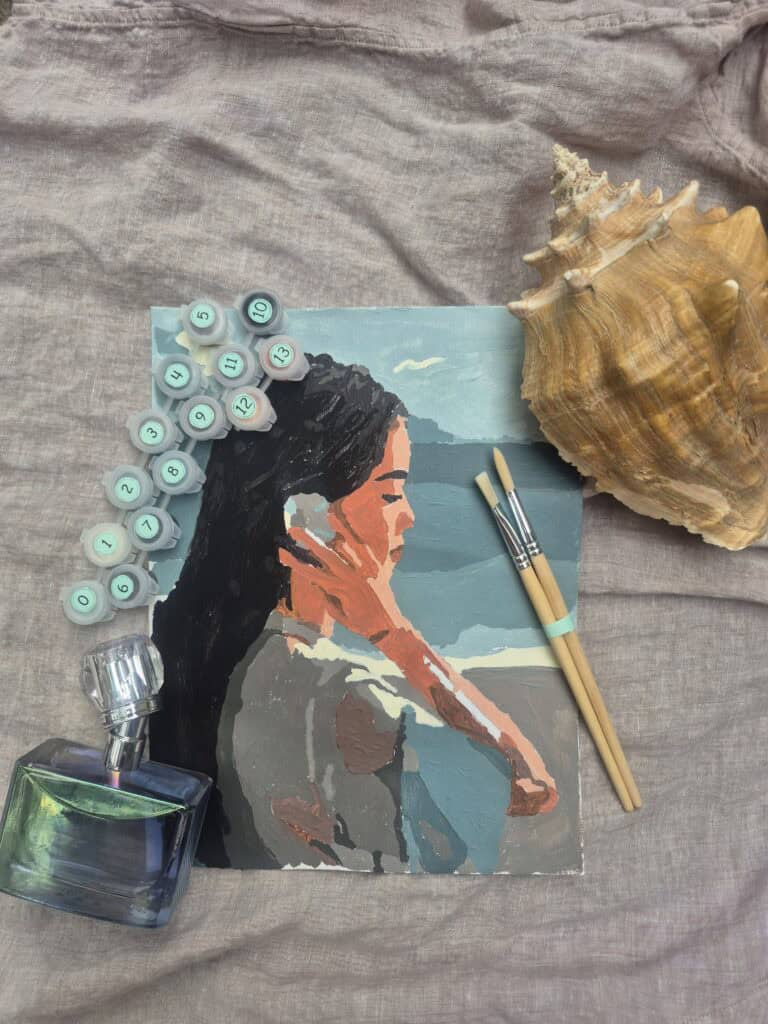 A painting of a woman holding a seashell to her ear on a beach
