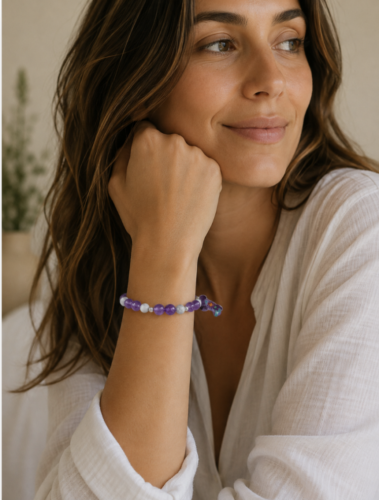 Amethyst and howlite handmade bracelet with a purple cowboy boots and hat charm at the center.