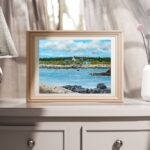 a print of seal island nova scotia featuring a coastal landscape of old buildings and a church with a wharf and slipway and an ocean foreground