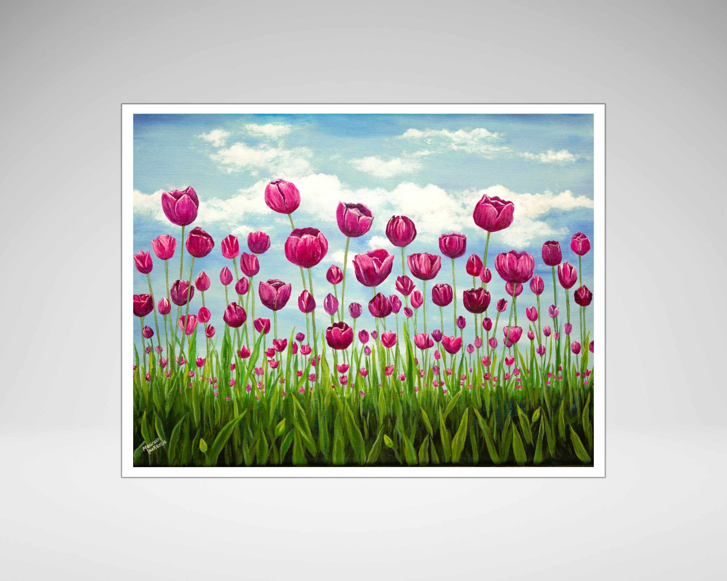 a giclee print of a field of pink vibrant tulips standing tall in a green field. The sky behind them is soft blue with fluffy clouds