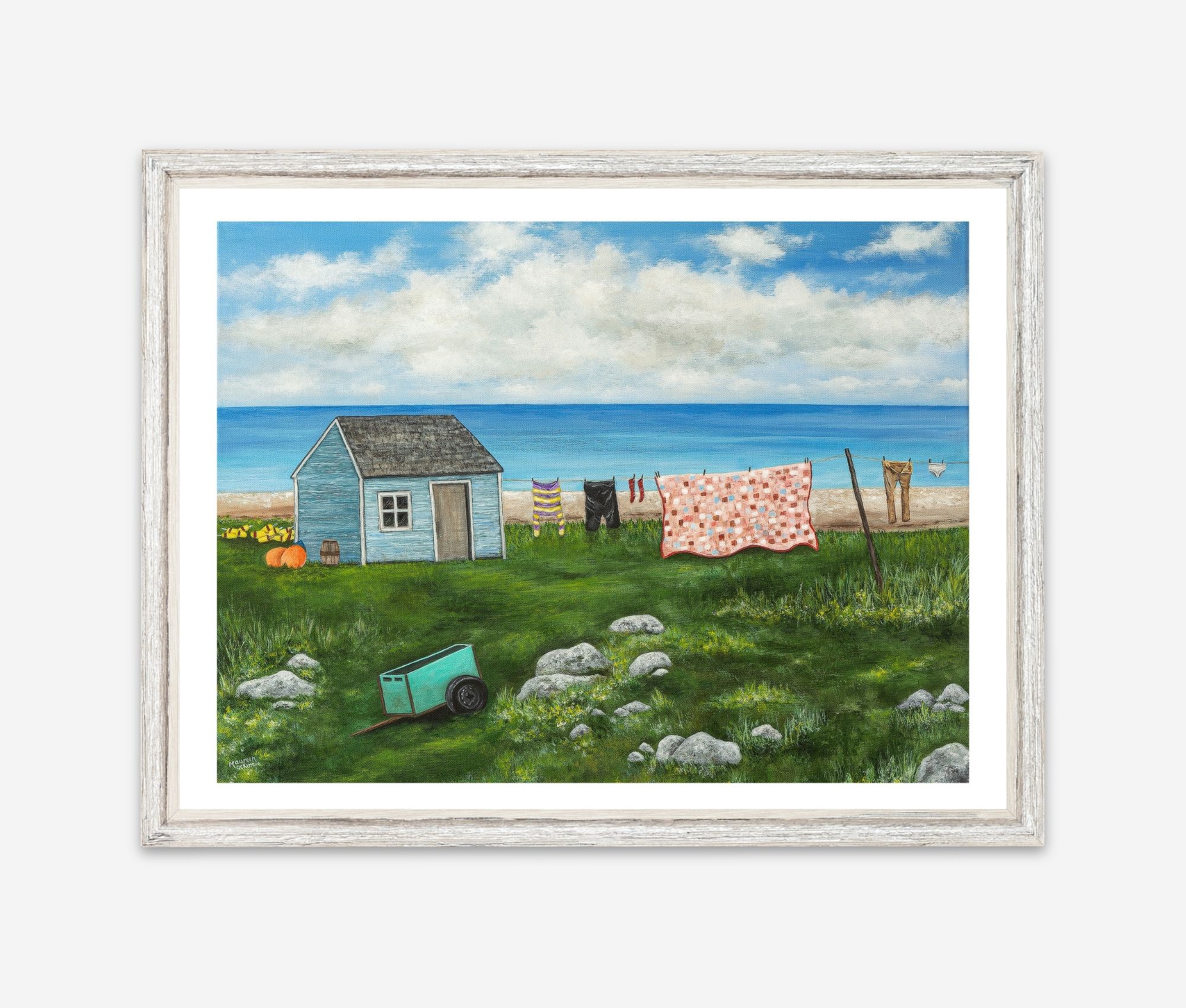 giclee print of seal island nova scotia featuring a shanty, a clothesline with clothes and a quilt and a green cart on a rocky field.