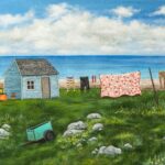 giclee print of seal island nova scotia featuring a shanty, a clothesline with clothes and a quilt and a green cart on a rocky field.