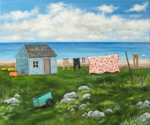 giclee print of seal island nova scotia featuring a shanty, a clothesline with clothes and a quilt and a green cart on a rocky field.