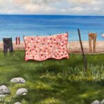 a close up of a print showing a quilt and clothes on a clothesline