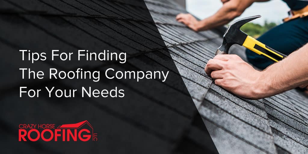 Licensed roofing contractor inspecting shingles on a residential roof emphasizing quality roofing services