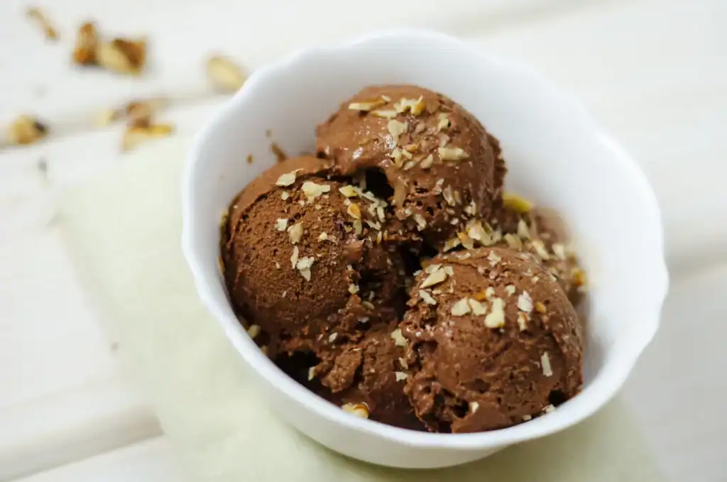 Delicious chocolate hazelnut gelato served in a white bowl, perfect for dessert lovers.