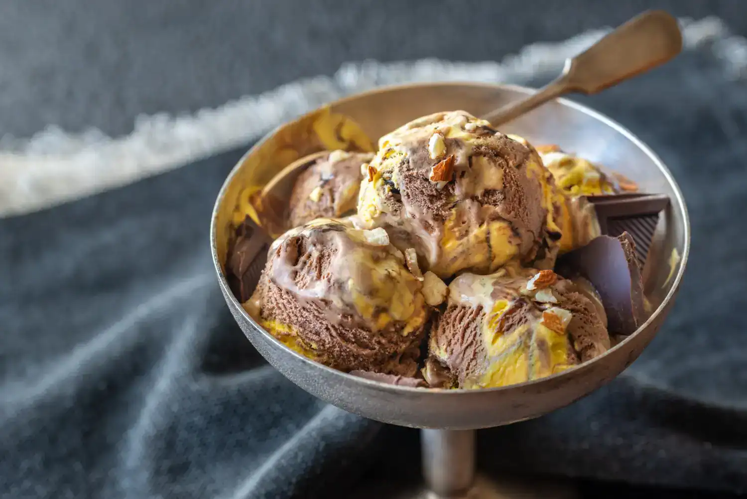 Delicious homemade chocolate orange ice cream with swirls of orange flavor and chocolate chunks.