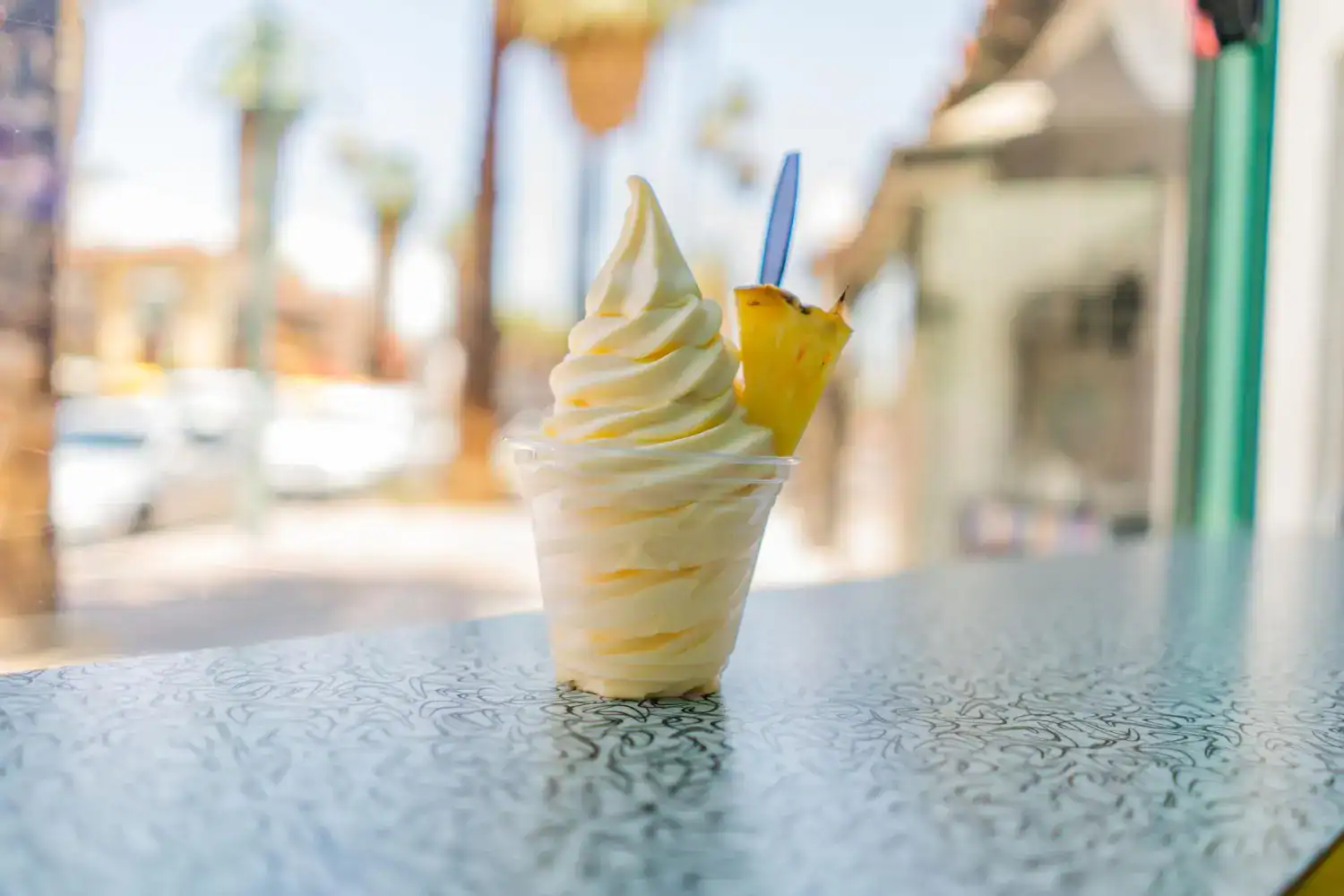 Delicious homemade Dole Whip served in a swirl cone, perfect for a refreshing treat.