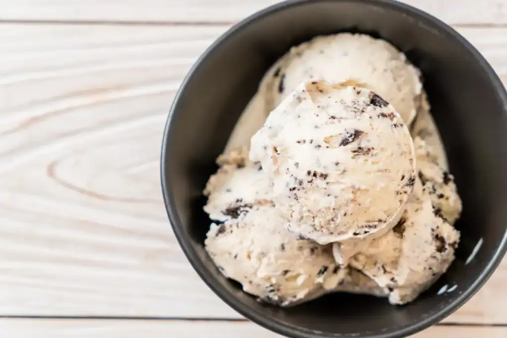 Delicious Keto Almond Joy ice cream with almonds and coconut flavor, perfect for low-carb dessert lo.