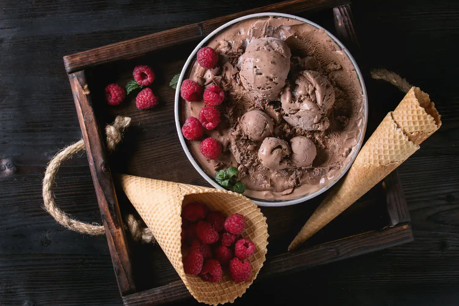 Delicious keto-friendly dark chocolate raspberry ice cream with creamy texture and fresh berries. Pe.