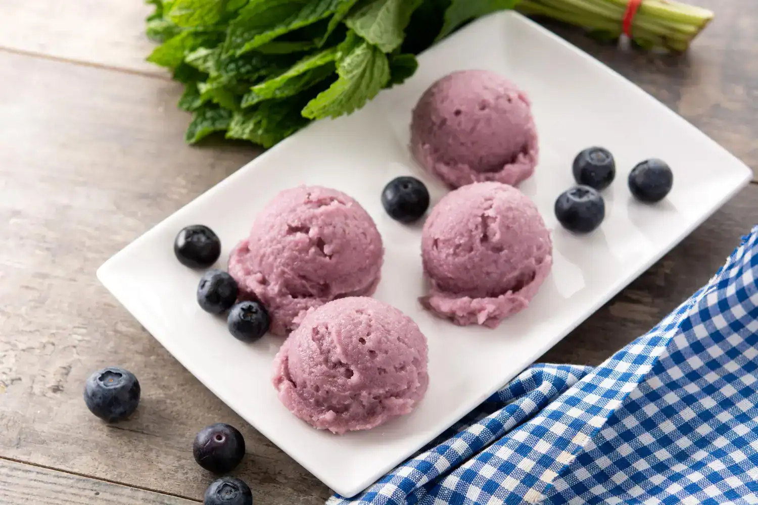 Keto Lemon Blueberry Ice Cream with fresh blueberries and lemon flavor, perfect for a healthy desser.