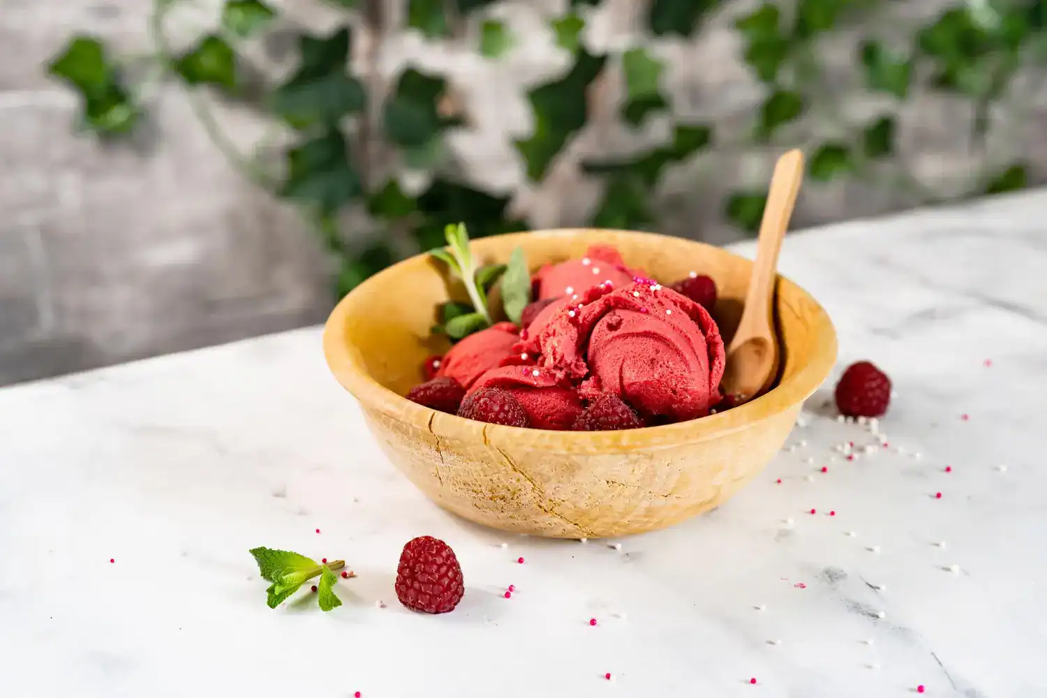 Delicious Lemon Raspberry Sorbet served in a wooden bowl, perfect for a low-calorie dessert. Refresh.