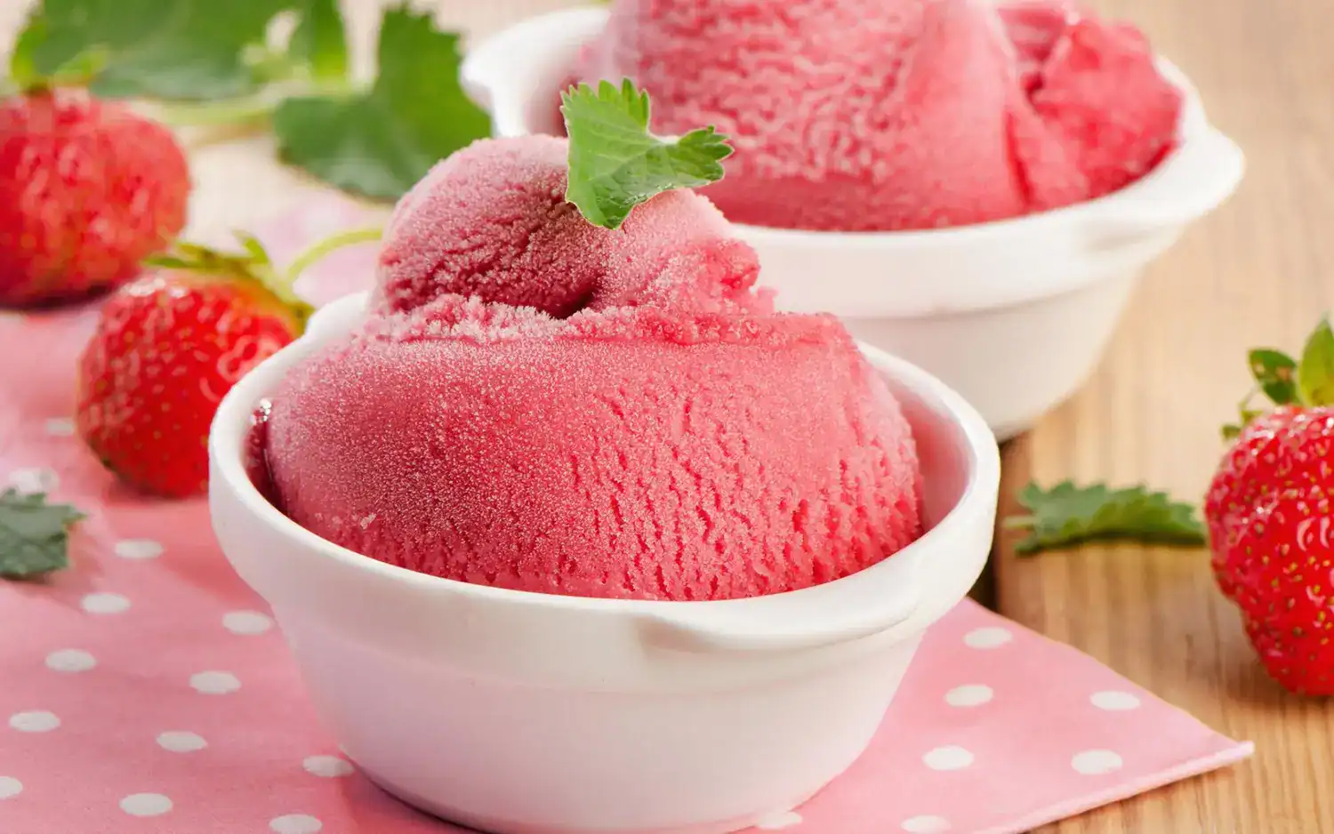 Delicious homemade strawberry sorbet served in a white bowl, perfect for a refreshing treat.