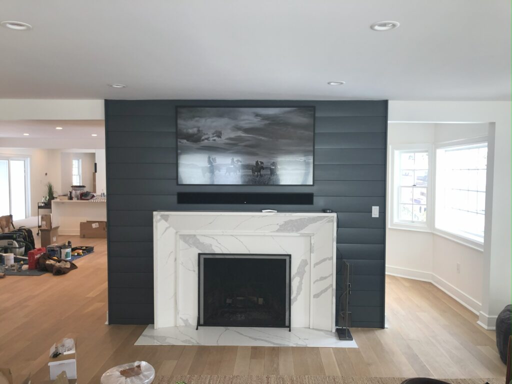Marble Fireplace Surround with Custom Painted Shiplap in Syosset Ny by Creatively Done Homes Improvements