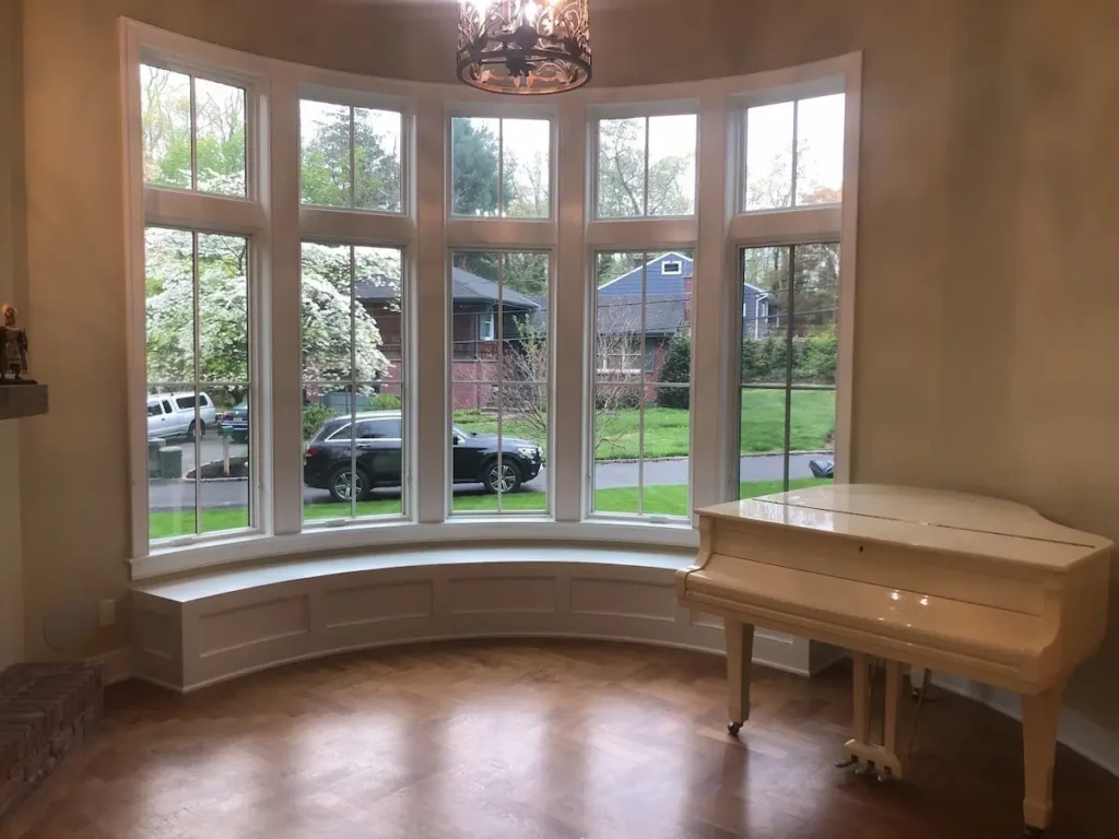 Custom Half round Window Seat with Raised Panels Fabricated and Installed During a Home Renovations Nassau County Project by Creatively Done Homes Improvements