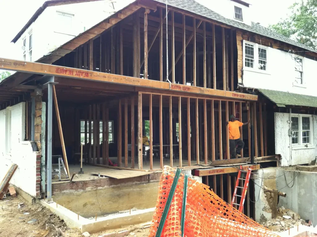 Crane Lifting a Large Structural Steel Beam for a Major Home Extension and Remodel in Nassau County