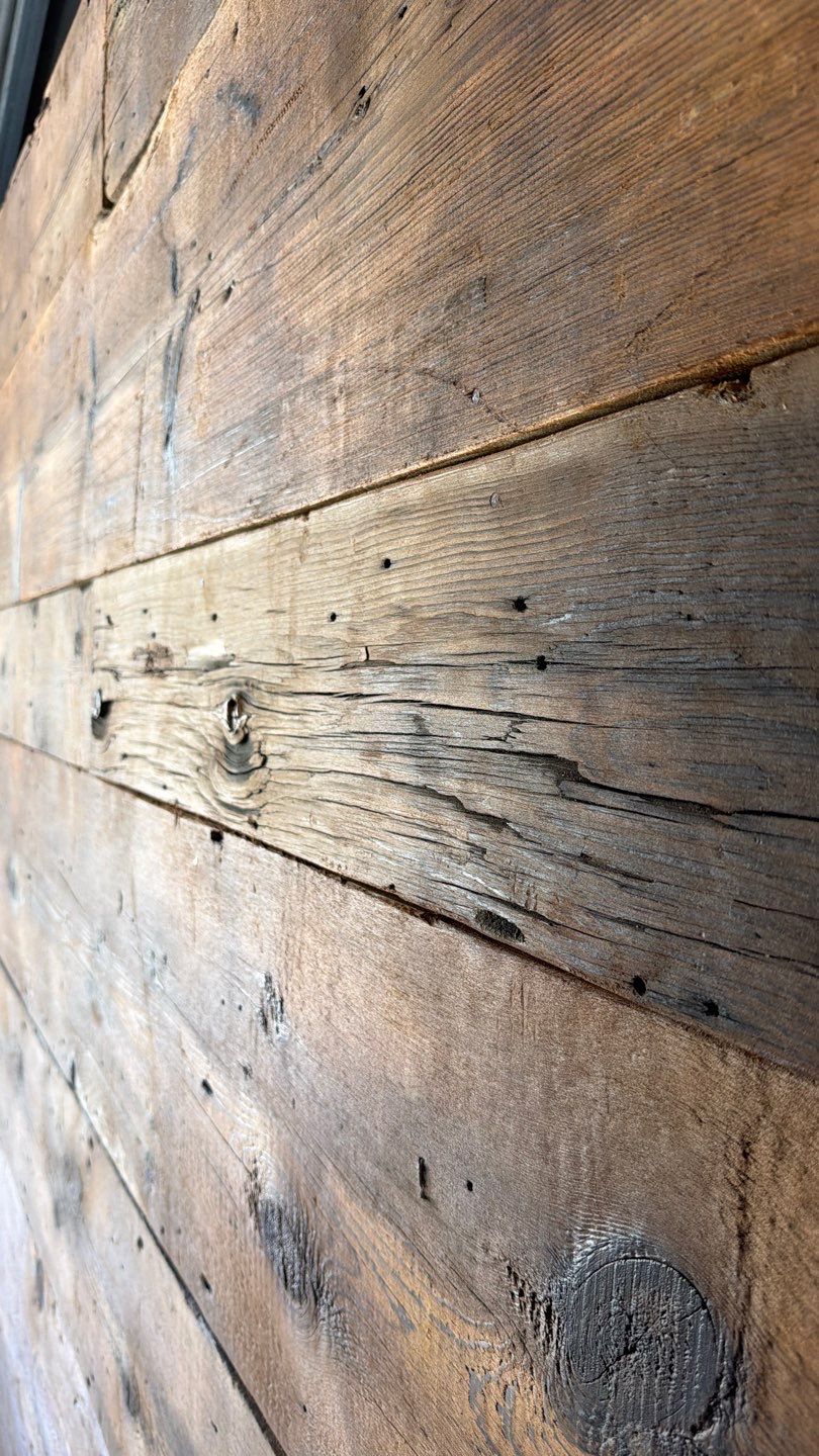 Side profile of reclaimed barn wood boards after milling straight showing uniform edge and depth by Creatively Done Homes Improvements