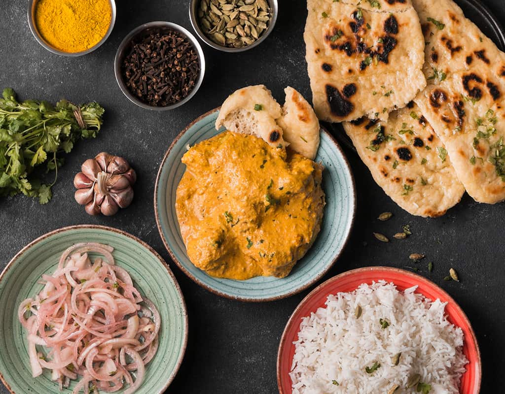 Crown Indian Cuisine, authentic Indian dishes with naan, curry, rice, and spices.