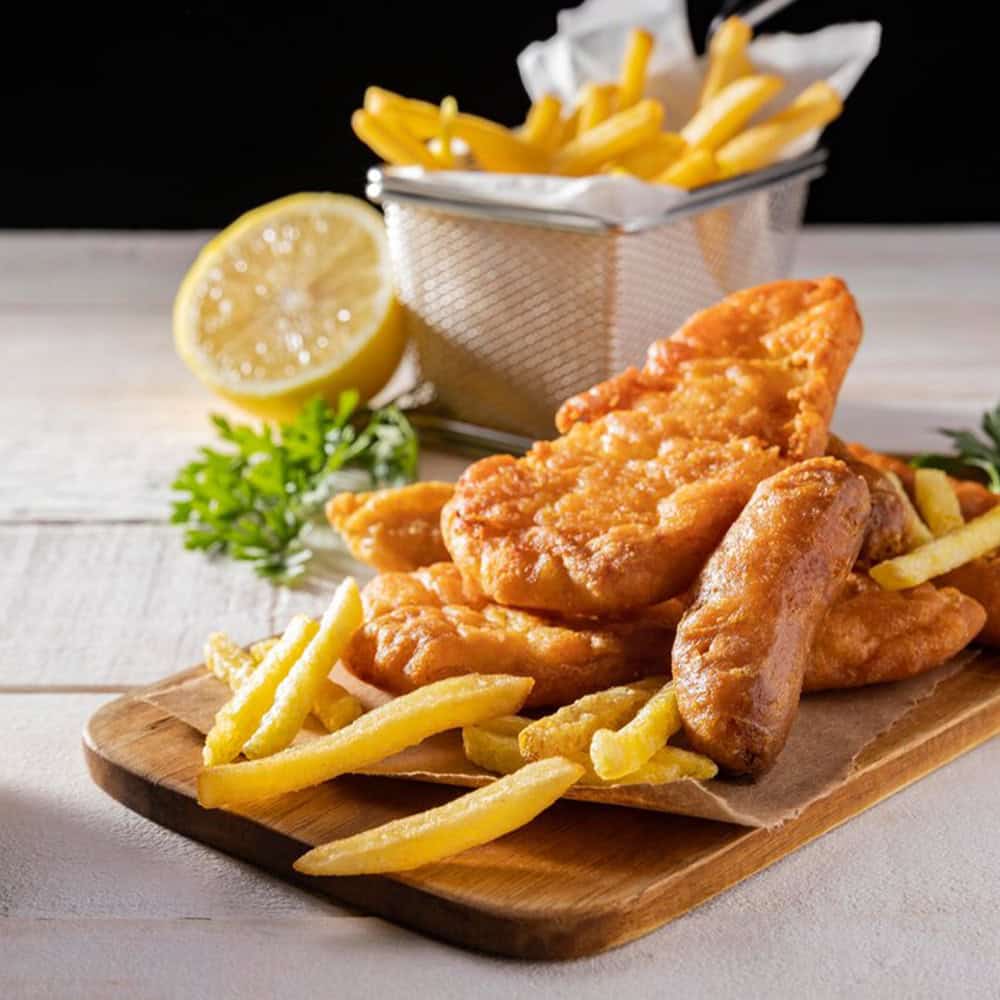 Crispy fried chicken with fries, lemon, and herbs at Crown Indian Cuisine Windang. Authentic Indian and seafood dishes, perfect for dine-in or takeaway.