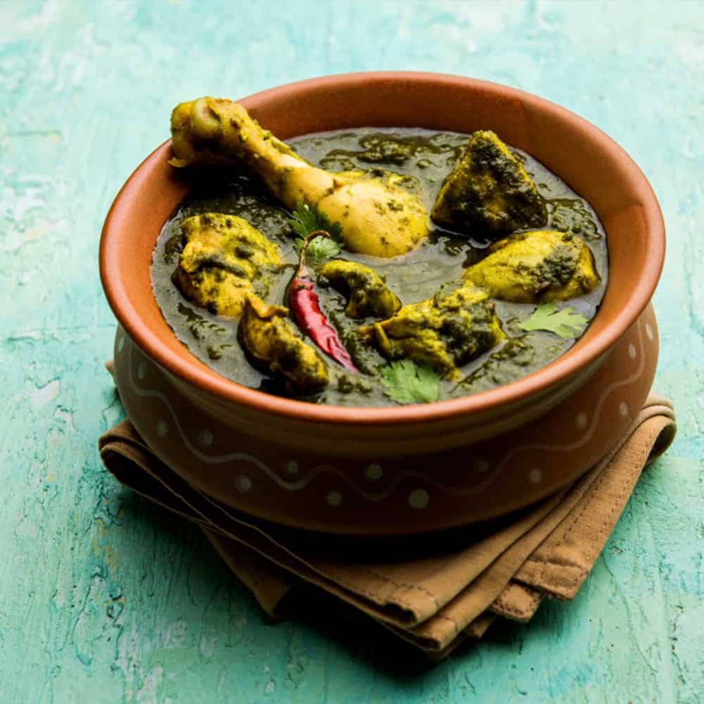 Spicy Indian chicken curry with herbs in a clay bowl at Crown Indian Cuisine Windang.