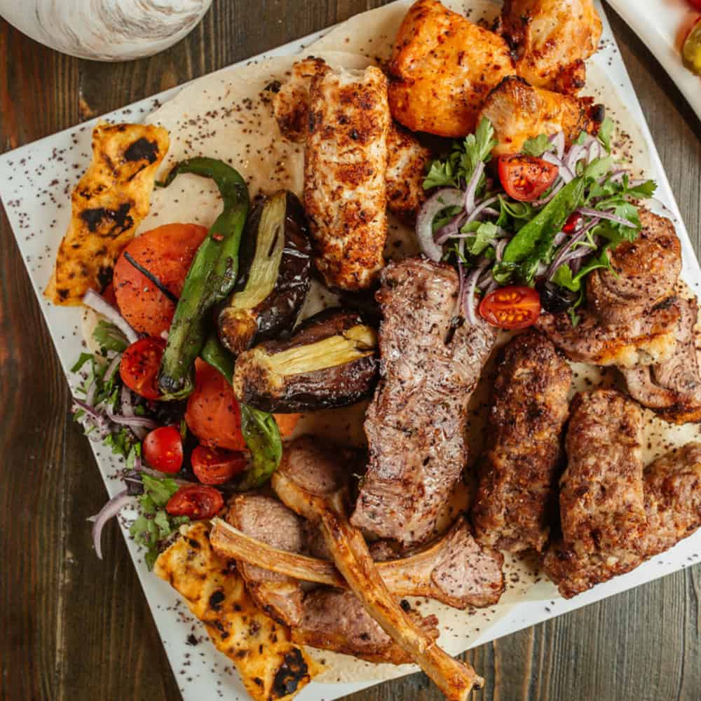 Succulent Indian grilled meats and vegetables platter with fresh salad, perfect for authentic Indian cuisine Windang.