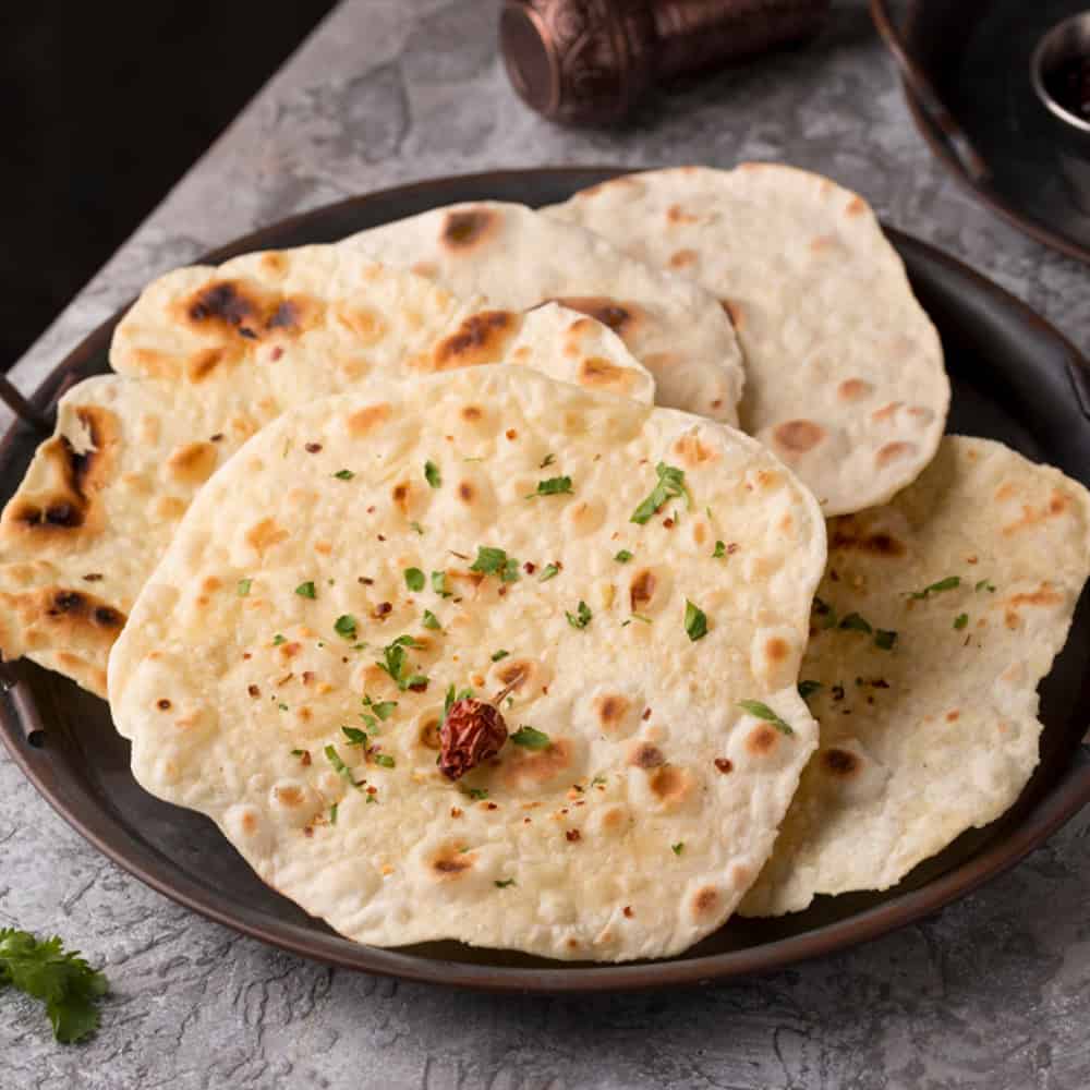 Flavored Indian naan bread served at Crown Indian Cuisine Windang, fresh and authentic.