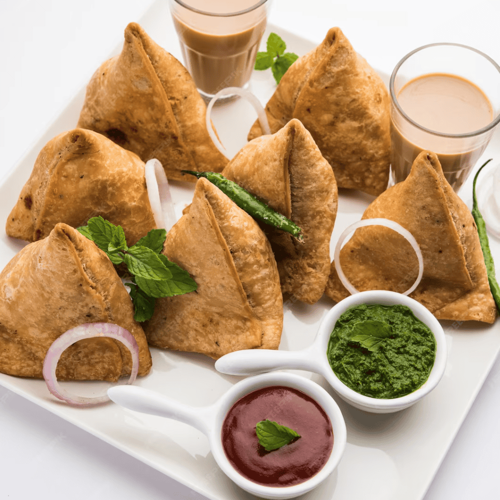Crispy Indian samosas with green chutney and drinks, authentic Indian cuisine in Windang.