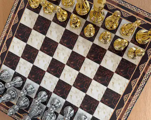 A premium Dal Rossi chess set left out on the table at home, mid-game