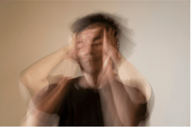 Person experiencing stress, seeking anxiety relief through hypnotherapy.