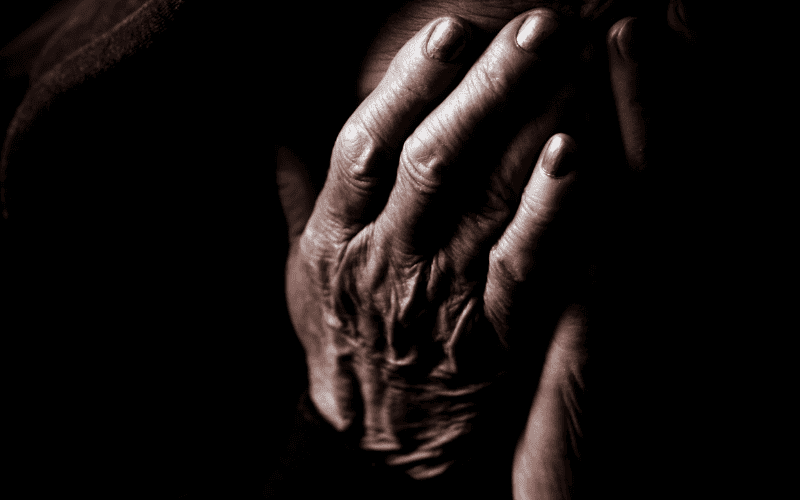 Close-up of hands in meditation for hypnotherapy session.