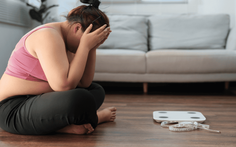 Woman experiencing stress, seeking hypnotherapy for anxiety relief.