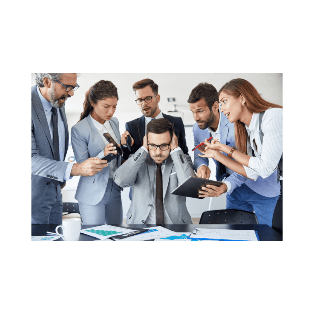 A professional man covering his ears as a group of colleagues surrounds him with suggestions, devices, and reports.
