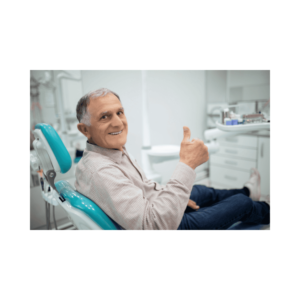 A happy patient giving a thumbs up after a successful and anxiety-free dental visit.