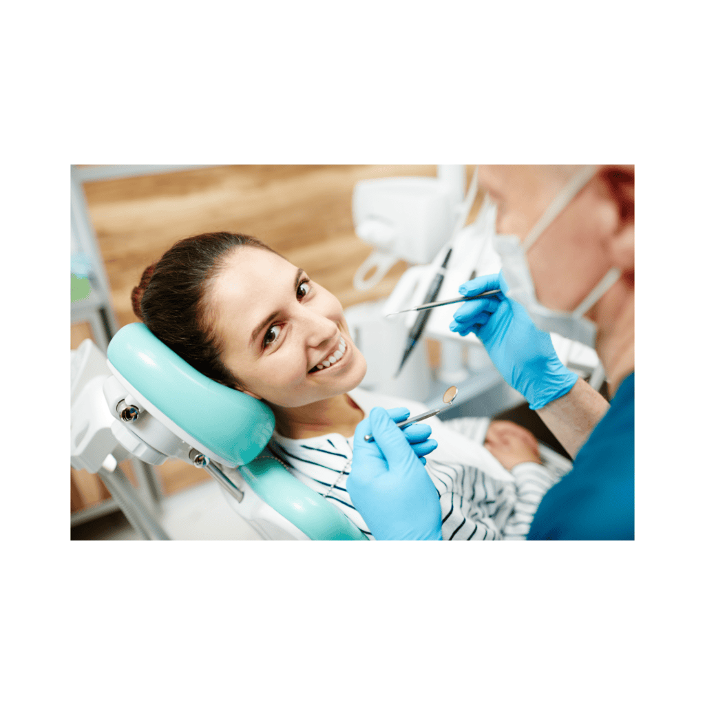 Smiling woman at the dentist for dental phobia treatment with hypnotherapy.