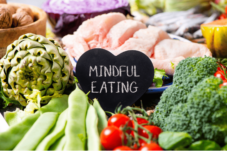Fresh ingredients arranged beside a mindful eating sign
